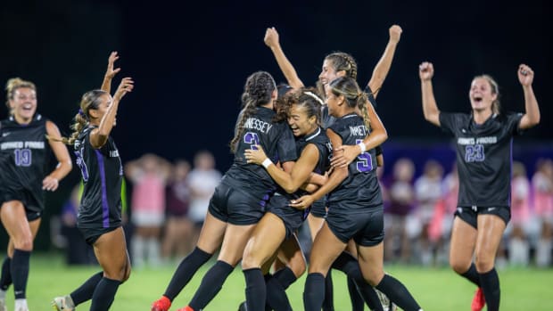 The Horned Frogs celebrate Seven Castain's game-winning goal in the 87th minute.